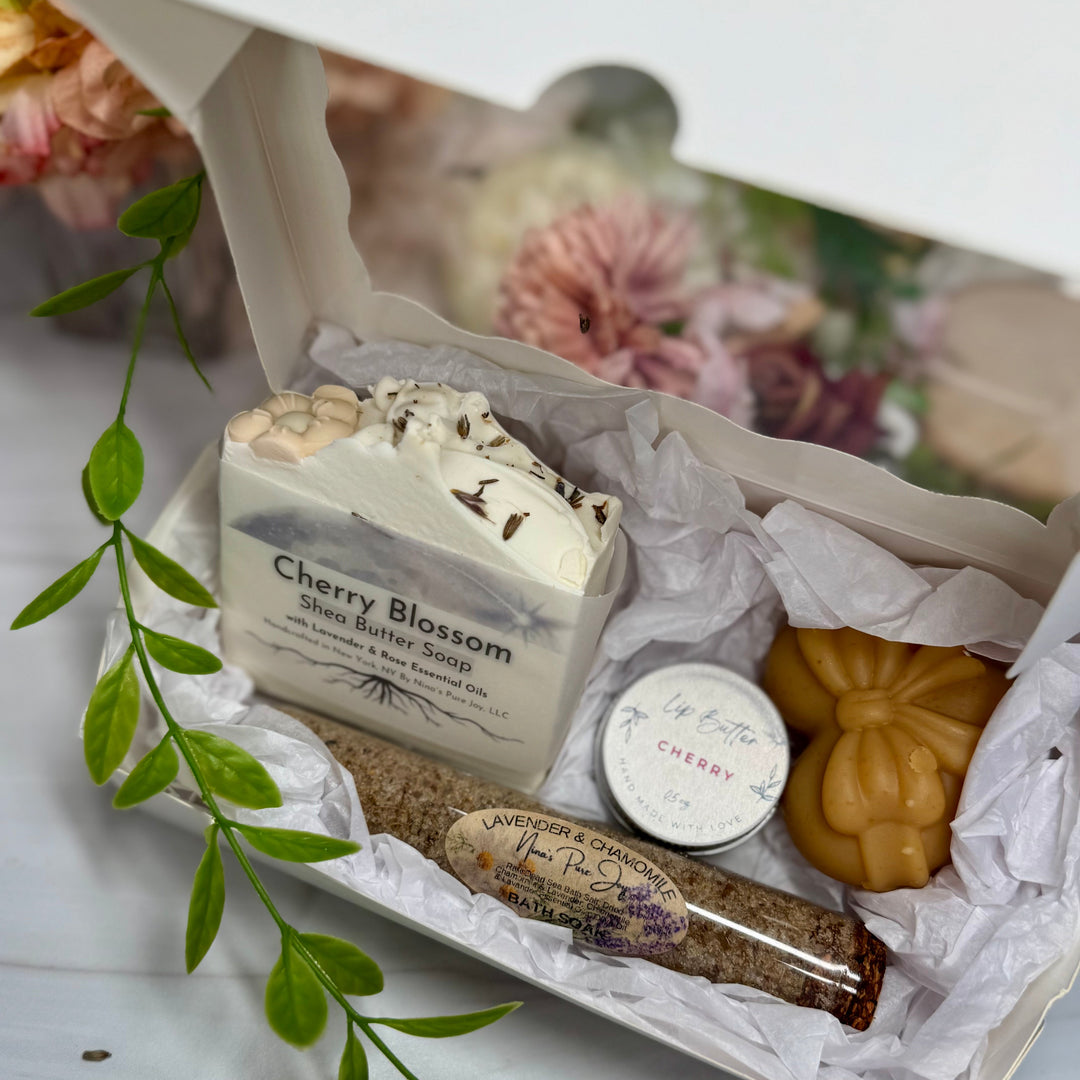 Gourmet soap set with cherry blossom flavor on a white surface with floral background