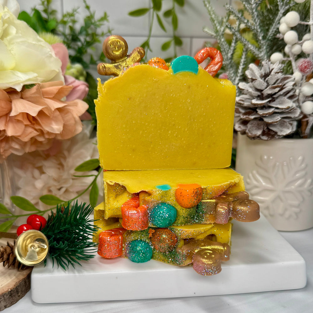 Colorful layered soap in yellow with ginger bread and candy cane decor
