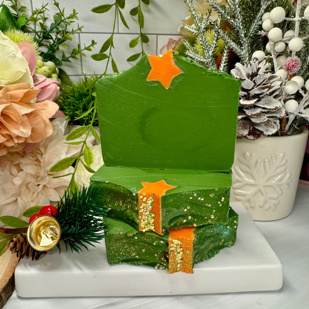 Green soap with gold accents on a white surface with decorative elements
