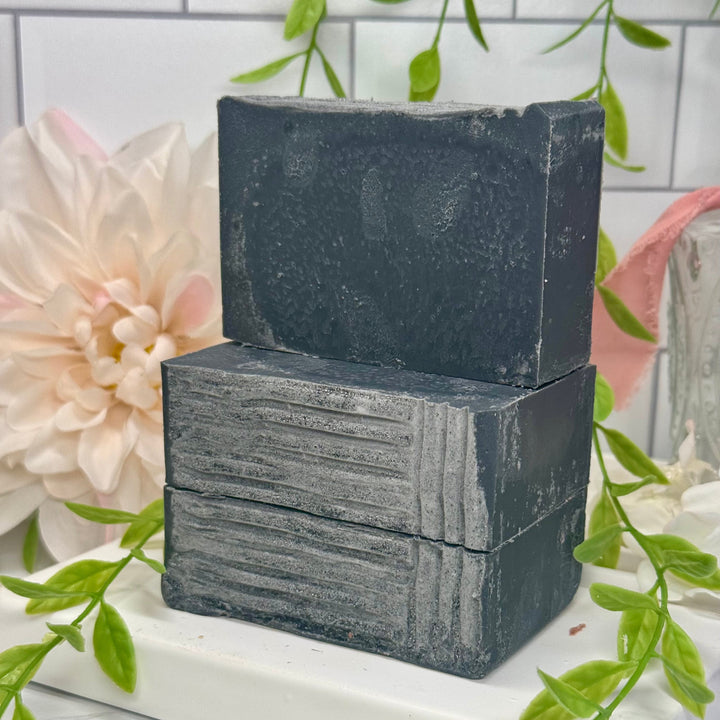 Cedarwood eucalyptus aloe vera soap, aloe vera charcoal soap, lump of coal aloe vera soap, handmade cedarwood eucalyptus soap, moisturizing charcoal aloe vera soap, nourishing cedarwood eucalyptus soap, natural lump of coal soap, hydrating cedarwood eucalyptus aloe vera soap, detoxifying charcoal aloe vera soap, eucalyptus cedarwood charcoal soap.